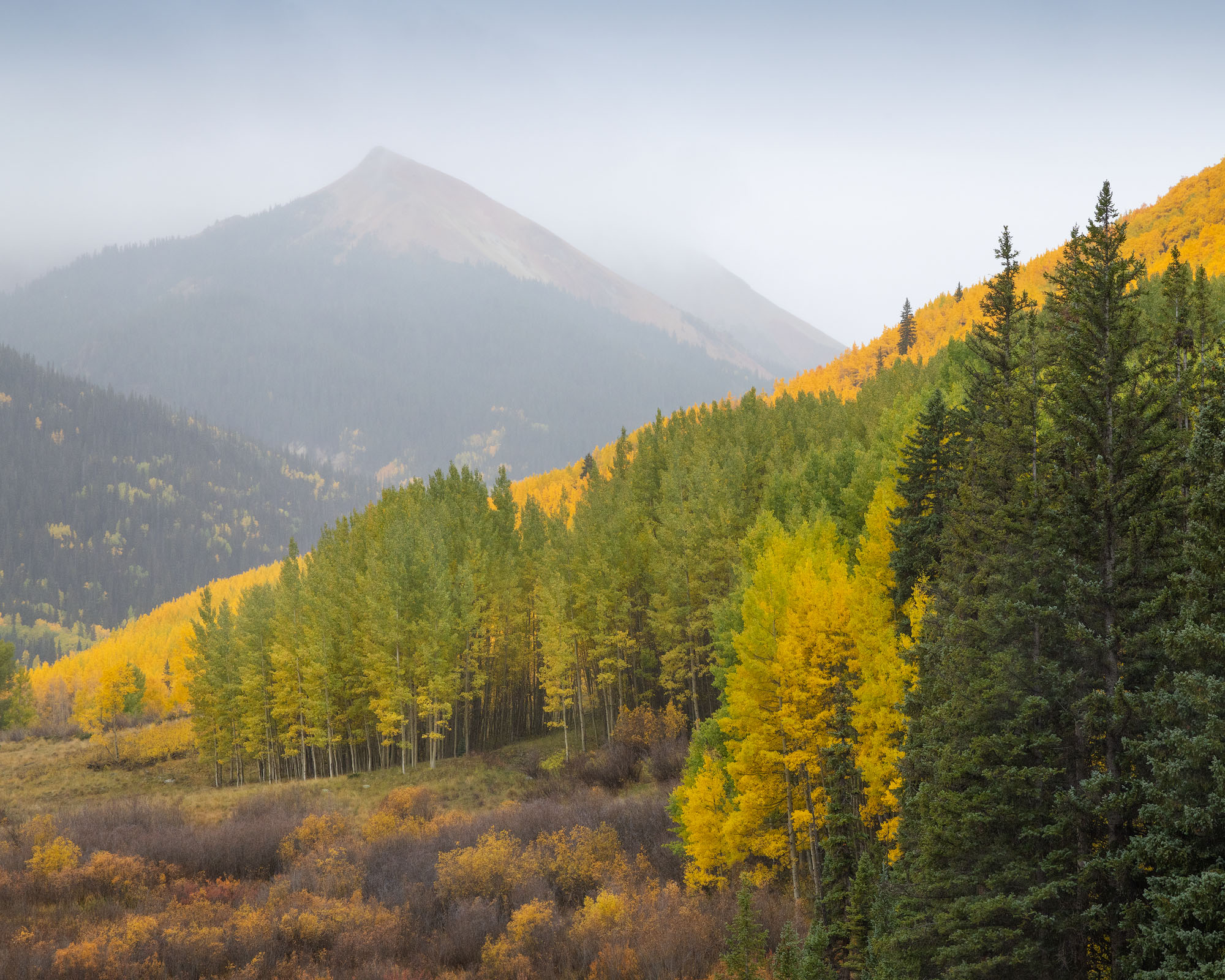 With the Rain An autumn rain storm moves through Colorado's San Juan Mountains.