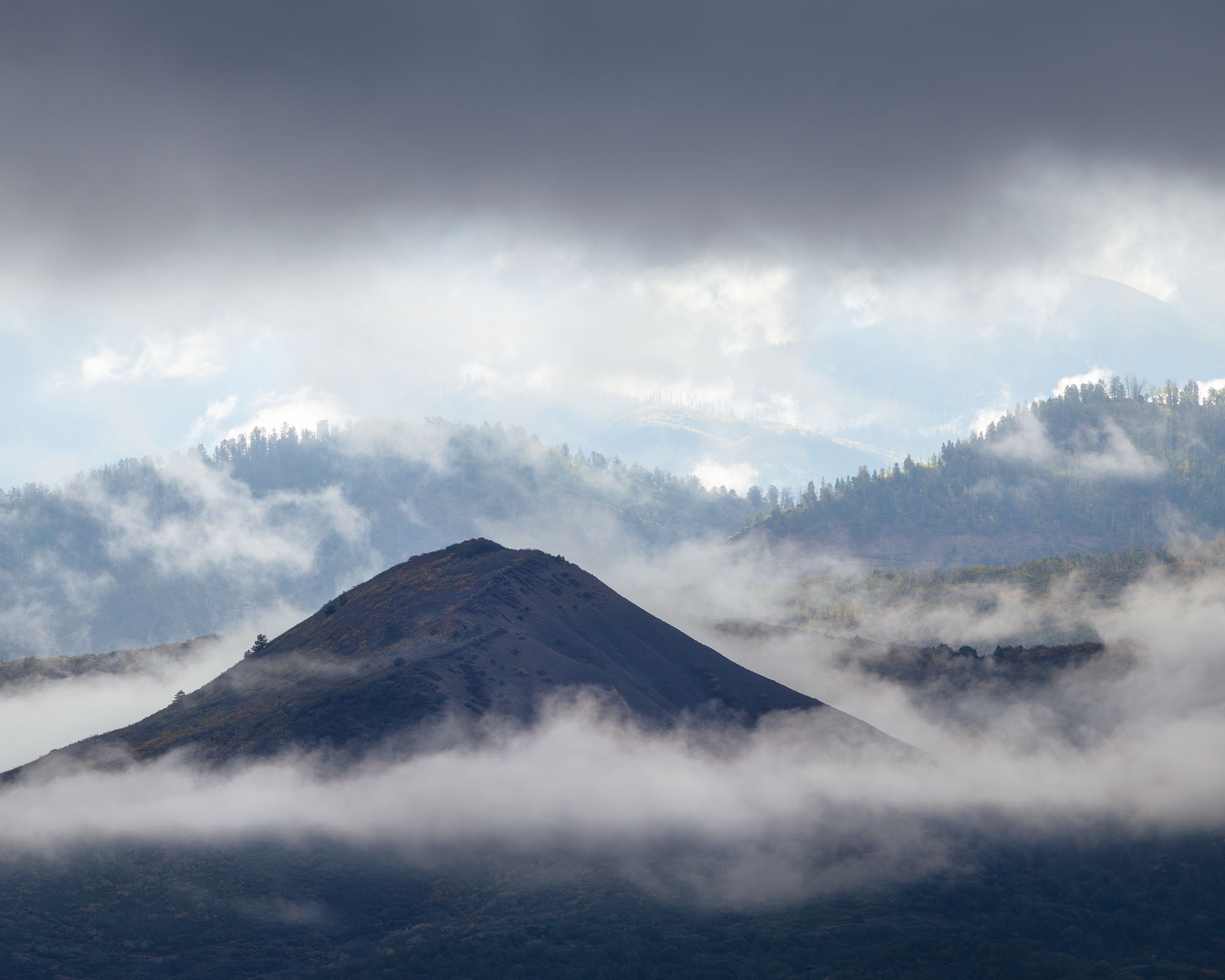Autumn Fog, Cimarron Mountain Foothills Low clouds wrap around the foothills of the Comarron Mountains in southwestern Colorado.